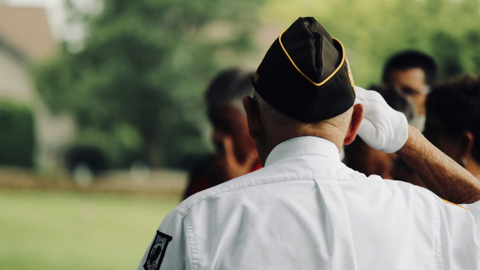 A war veteran saluting.