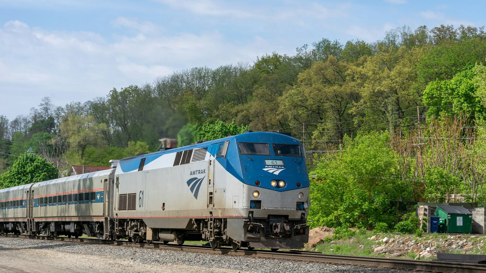 An Amtrak train on railroad tracks.