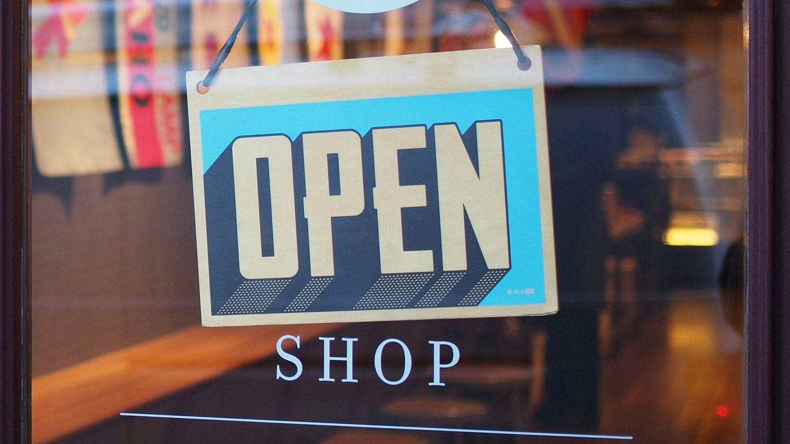 An open sign in a shop door.