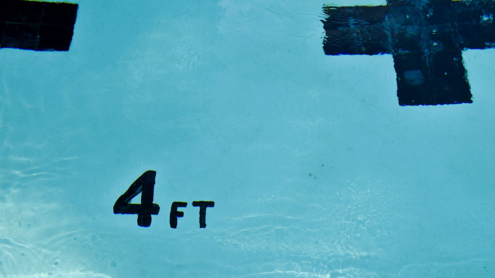 A 4 ft deep marker in a pool.